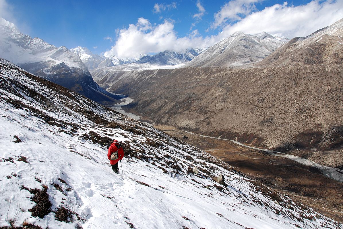 12 Gyan Tamang Descending Ridge From Taro Tso Towards Drakpochen After eating lunch next to Tara Tso (4363m), we ascend the ridge above the lake (4444m) and Gyan Tamang descends ahead of me towards the big rock at Drakpochen (4139m).